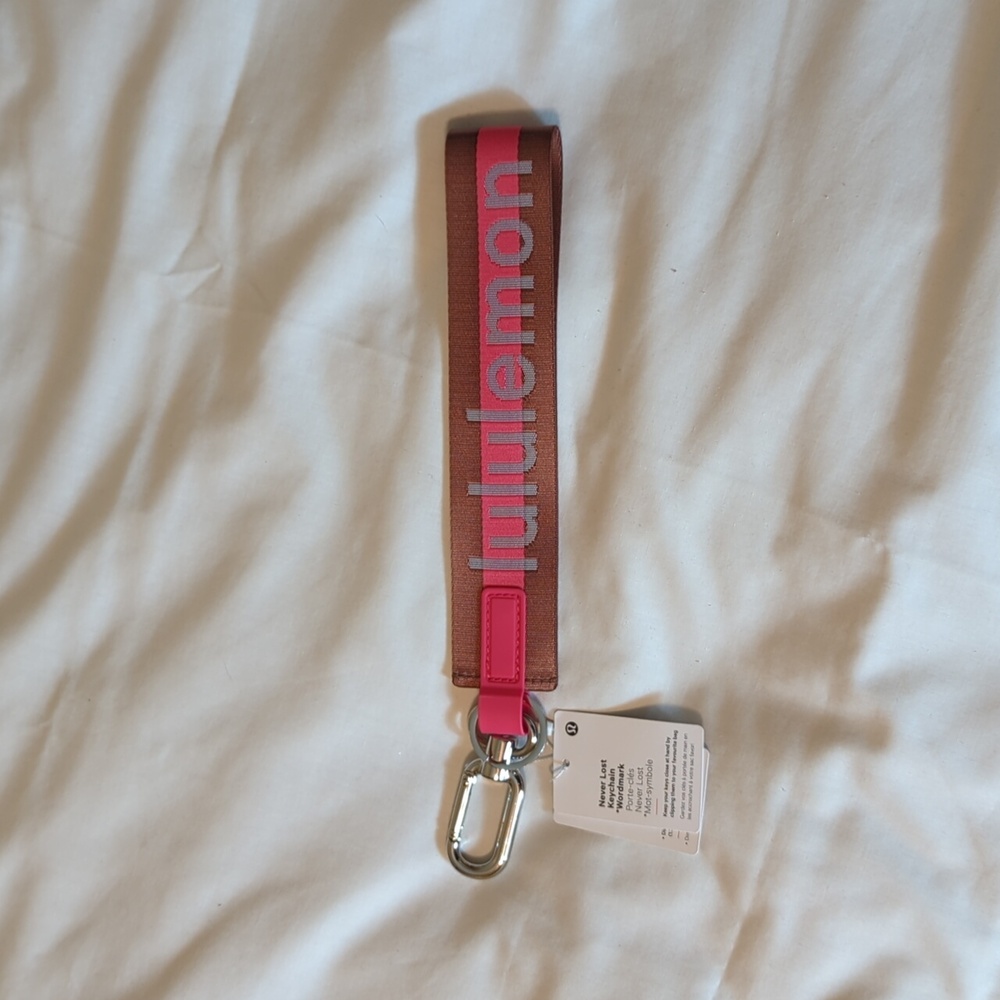 Lululemon | never lost keychain | burnt apricot and terra orange NWT